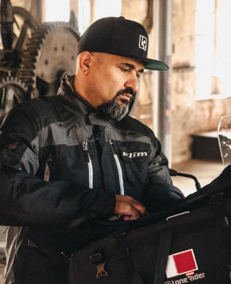 Khalid Al Jaber Global Explorer & Strategic Adventurer. Turned his Motorcycle into his office.